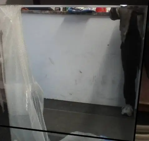Beveled mirror on hardwood backing board