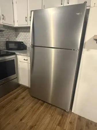 Whirlpool fridge and stove. Stainless