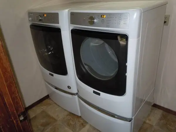 Maytag HE washer/electric dryer combo with pedestals, like new