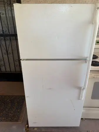 A apartment size refrigerator white ge very good condition