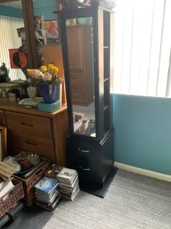Tall swivel jewelry case tower