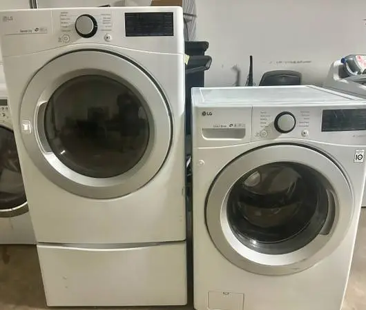 Lg Front Load Washer and Electric Dryer Set 60 day guarantee