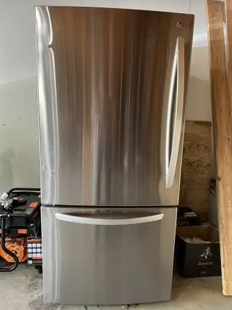 LG 25.5-cu ft Refrigerator 33-in Wide with Ice Maker 2 yr old