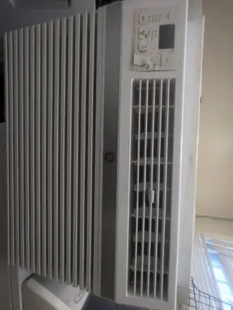 GE 14,300 BTU air conditioner with window bracket