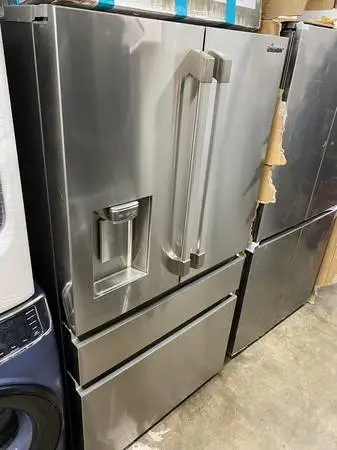 Dacor refrigerator  and slide in gas range