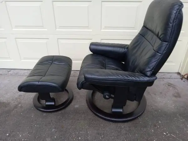 BLACK EKORNES STRESSLESS RECLINER AND OTTOMAN