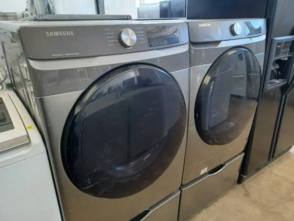 Samsung Grey Front Load Washer/Electric Dryer Set On Pedestals