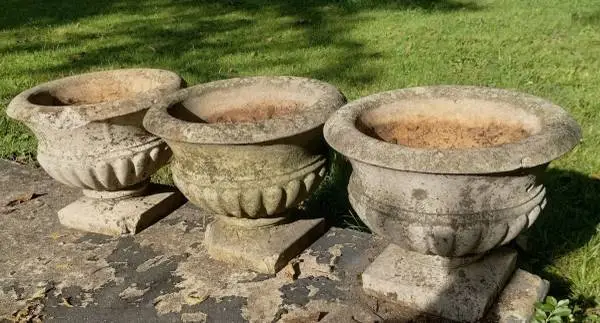 Three vintage concrete flower pots