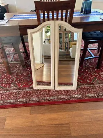Wood framed window with mirrors