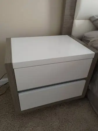 Two white nightstand drawers