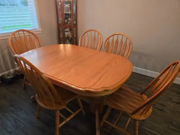 Sold wood dinette set with 2 extentions