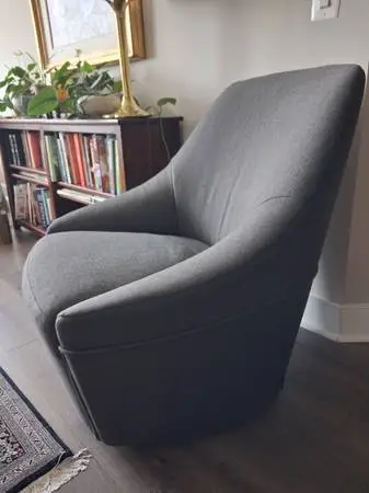 Revolving arm chair by Calligaris