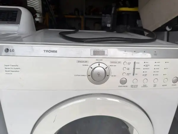 LG Tromm washer and Dryer Set. Works perfectly. Firm on the price.
