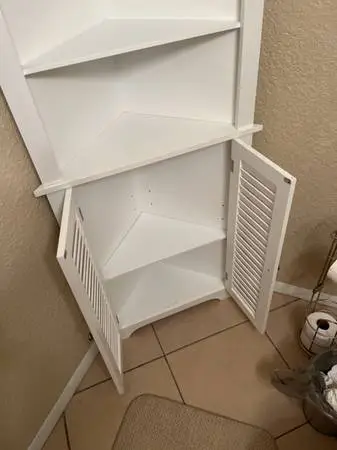 Storage cabinet for corner