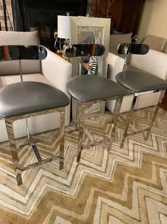 THREE INTERLUDE CHROME and LEATHER COUNTER STOOLS