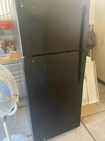 GE black refrigerator over under
