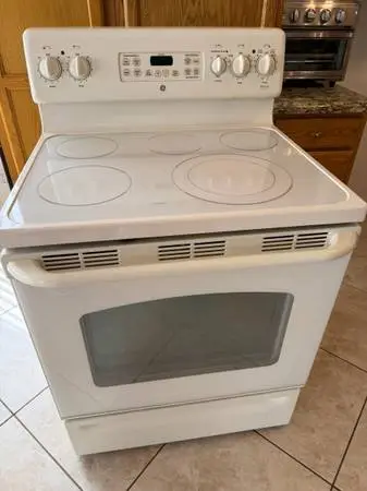 Refrigerator , electric range, dishwasher, and microwave all in bisque color