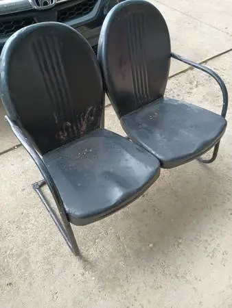 Black metal clamshell loveseat