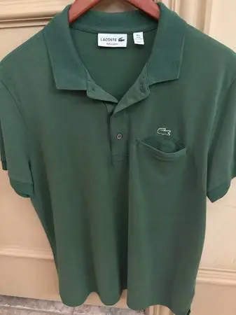 Reduced!  Lacoste men’s polo green with pocket.