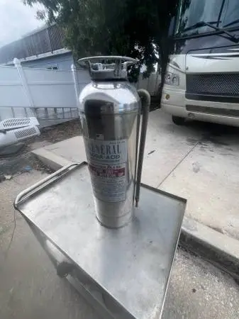 Authentic vintage soda-acid fire extinguisher in solid condition