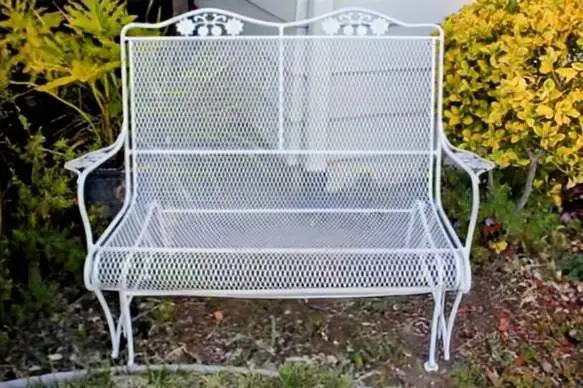 Wrought-iron Patio Glider.... heavy metal nice cond