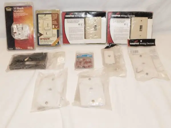 GROUP LOT OF NEW PHONE PARTS AND ELECTRICAL PLATES NEW IN PACKS