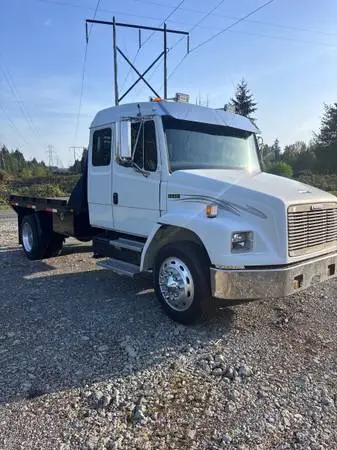 2000 FL60 extended cab, 11’ flat bed, 5.9 Cummins, 6 speed manual