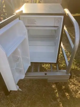 Small refrigerator / freezer. Works Perfectly. 25” high, 17” wide, 19” dee