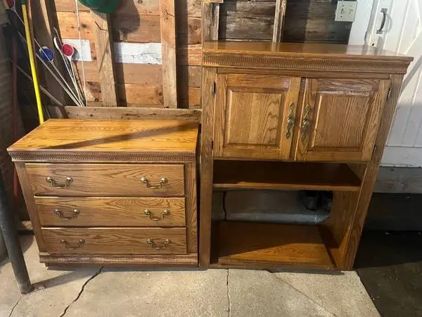 Heavy wooden entertainment center with large, deep drawers