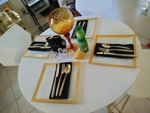White table set with four chairs