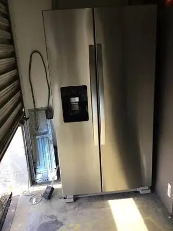 Stainless steel whirlpool side by side refrigerator