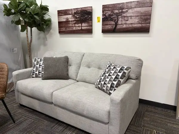 STORE CLOSING LAST DAY. Brand New Ashley Sofa in factory plastic