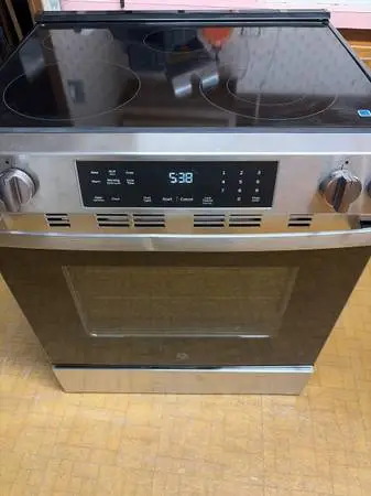 New ge stainless 30 in Glass top electric slide in stove
