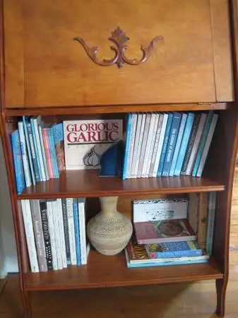 Cookbooks with bookshelf desk.