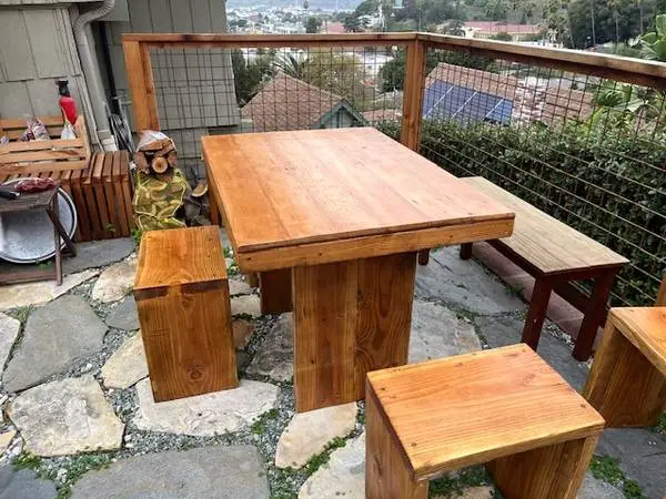 Plank style wood table and four stools