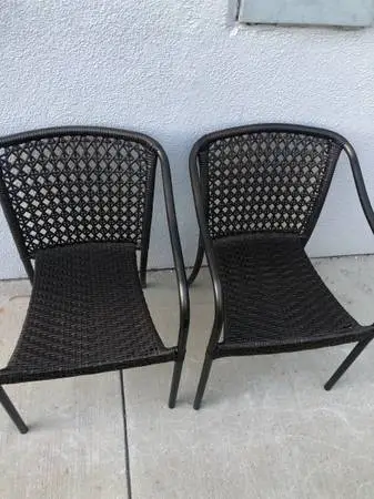 Set of 2 plastic/metal ,  wicker patio chairs
