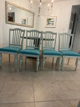 Painted wooden dining chairs with upholstered seats
