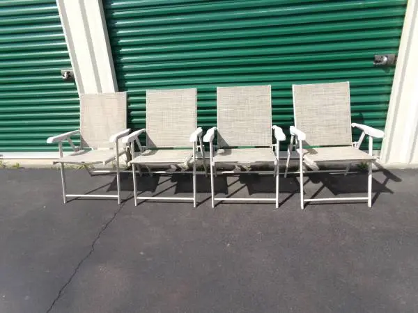 Four Beautiful Folding Plastic Arm Chairs