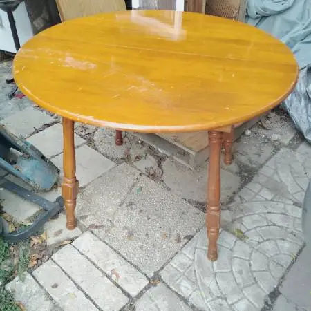 Dining room table, real wood, minor scuffs but still shines, $15