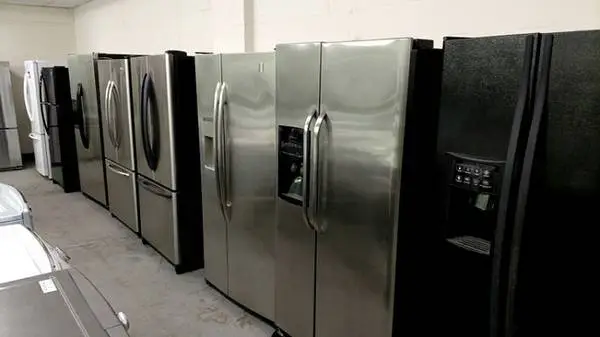 Side by side black and stainless steel refrigerator Units