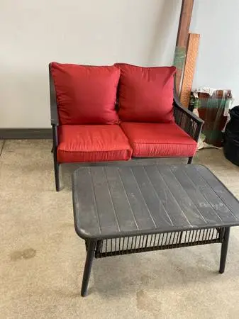 Patio loveseat and matching table for sale.
