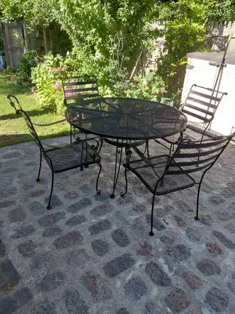 Wrought iron table and four chairs