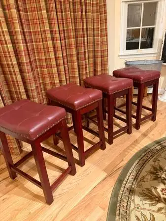 Four (4) Cranberr colored Counter Stools