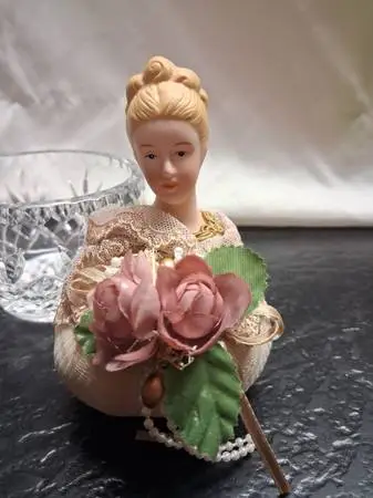 Porcelain doll pin cushion