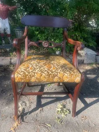 Antique mahogany carved arm chair