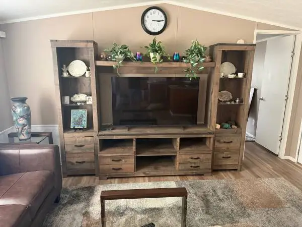Leather sofas, entertainment center, dressers, tables, TV