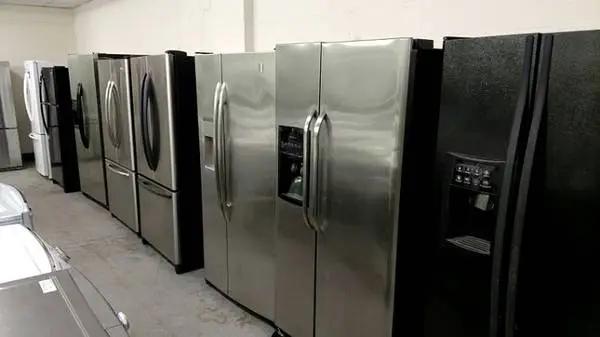 Side by side black and stainless steel refrigerator Units
