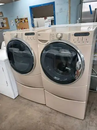 Kenmore elite washer and dryer set on pedestals
