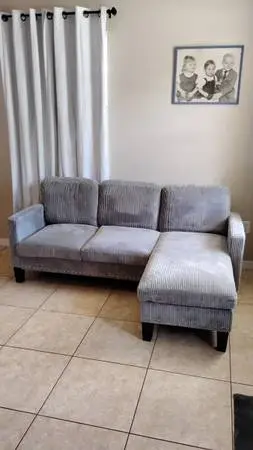 Newer smaller gray corduroy sofa with movable ottoman