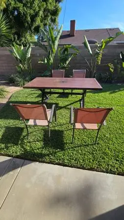 Big outdoor tin table, 39 inches by 76 inches with no rust and 4 chair